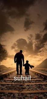 Father and child walking on railway at sunset.