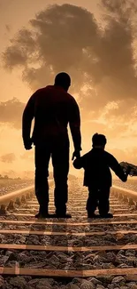 Father and child silhouette walking on railway tracks at sunset.