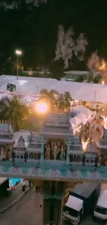 Vibrant festival night view with illuminated architecture.