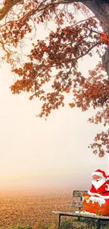 Santa Claus sitting by an autumn tree.