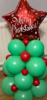 Christmas balloon tree with red star decoration.