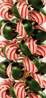 Festive green and red baubles wallpaper with candy-cane design.