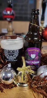 Festive beer bottle and ornaments display on a rustic table.