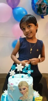 Child at a birthday party with a themed cake and colorful balloons.