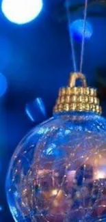 Blue festive wallpaper with ornament and lights.