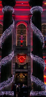 Grand building with red and white Christmas lights creating a festive atmosphere.