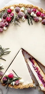 Festive cake slice with cream and berries, topped with rosemary sprigs.