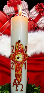 Festive Christmas candle with red gifts and decorations.