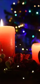 Red candles glowing with Christmas lights background.