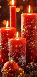 Red festive candles glowing warmly with decorative accents.