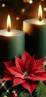 Festive green candles with poinsettia and bokeh lights.