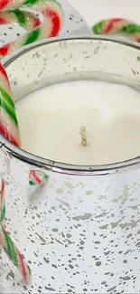 Candy canes and white candles create festive ambiance.