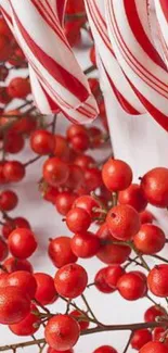 Festive wallpaper with candy canes and red holly berries.