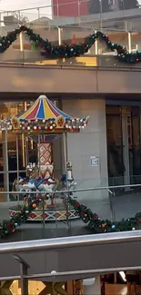 Colorful carousel in mall with festive decor.