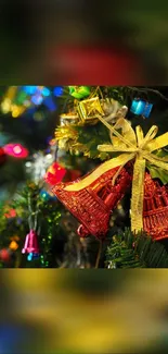 Christmas tree with red bells and colorful lights decorations.