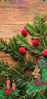 Christmas-themed wallpaper with evergreen branches, red berries, and wooden background.