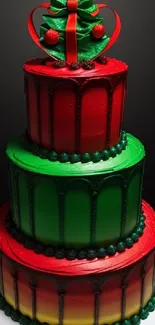 Three-tier red and green Christmas cake with festive decorations.