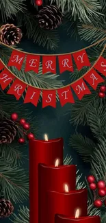 Red candles and pine with Merry Christmas banner