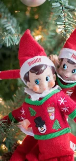 Festive scene with two playful Christmas elves on a holiday tree.