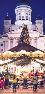 Vibrant Christmas market with cathedral at night.