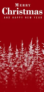 Red Christmas wallpaper with snowflakes and pine trees.