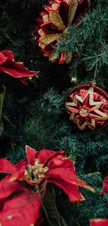 Festive wallpaper with red ornaments and poinsettias on green pine.