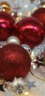 Red and gold Christmas ornaments with decorative lights.