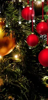 Festive Christmas ornaments with red and gold baubles on a green pine tree.