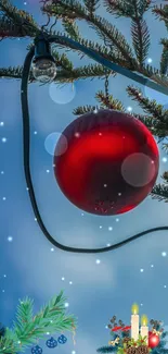 Red Christmas ornament with snowy fir branches and lights.