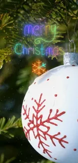 Christmas ornament on tree branch with festive greeting.