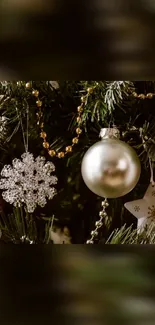 Festive Christmas tree with ornaments and baubles in silver and gold.