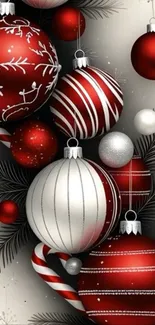 Festive Christmas ornaments with red and silver decorations on a mobile phone wallpaper.
