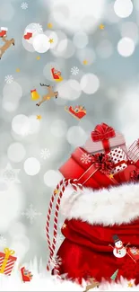 Red Christmas gift bag wallpaper with reindeer and snowy backdrop.