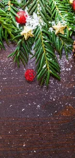 Festive Christmas wallpaper with pinecones and ornaments on wooden background.