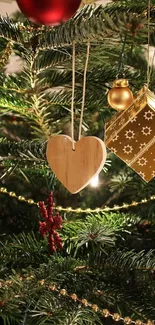 Christmas tree with heart-shaped ornament and lights.