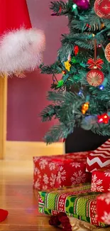 Child reaching for gift under decorated Christmas tree.