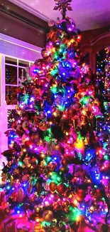 A vibrant Christmas tree with colorful lights illuminating the room.