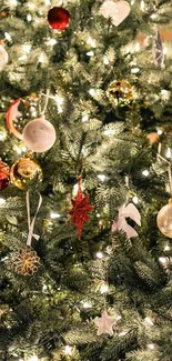 Festive Christmas tree with glowing lights and colorful ornaments.