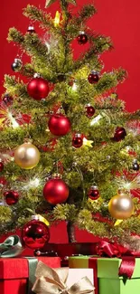 Vibrant Christmas tree with gifts on red background.