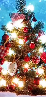 Christmas tree with lights and festive ornaments under a snowy sky.