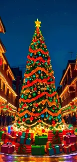 Vibrant Christmas tree with gifts at night in festive street.