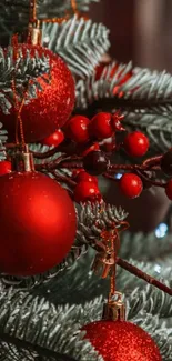 Festive Christmas tree with red ornaments and green pine branches.