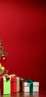 Festive Christmas tree with gifts on a red background.