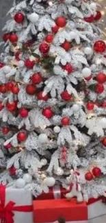 Festive Christmas tree with gifts and white snow.