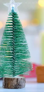 Festive green Christmas tree with star topper on wooden base.