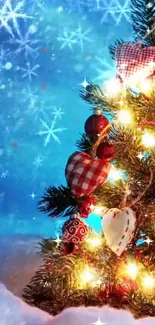 Festive Christmas tree with ornaments and lights against a blue snowy background.