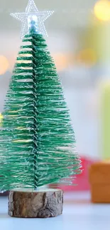 Green Christmas tree with a star on top, surrounded by festive lights and decorations.