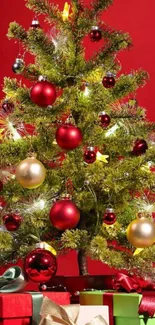 Christmas tree with ornaments and gifts on red background.