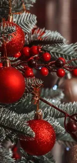 Christmas tree with red ornaments and branches.