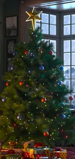 Decorated Christmas tree with lights and gifts by the window.